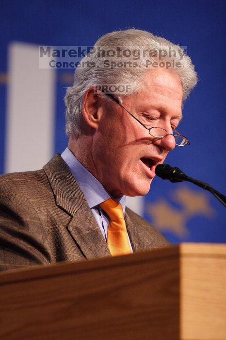 Former President Bill Clinton hands out commitment certificates to CGIU attendees for their exceptional pledges to the CGI cause during the opening plenary session of the CGIU meeting.  Day one of the 2nd Annual Clinton Global Initiative University (CGIU) meeting was held at The University of Texas at Austin, Friday, February 13, 2009.

Filename: SRM_20090213_16394582.jpg
Aperture: f/2.8
Shutter Speed: 1/250
Body: Canon EOS 20D
Lens: Canon EF 300mm f/2.8 L IS