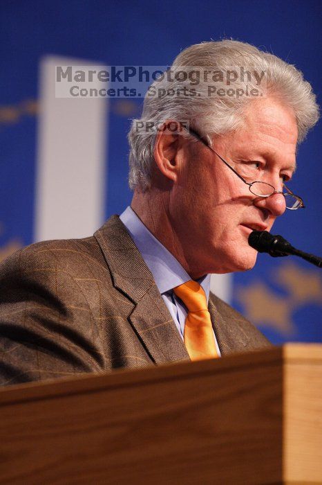 Former President Bill Clinton hands out commitment certificates to CGIU attendees for their exceptional pledges to the CGI cause during the opening plenary session of the CGIU meeting.  Day one of the 2nd Annual Clinton Global Initiative University (CGIU) meeting was held at The University of Texas at Austin, Friday, February 13, 2009.

Filename: SRM_20090213_16394783.jpg
Aperture: f/2.8
Shutter Speed: 1/250
Body: Canon EOS 20D
Lens: Canon EF 300mm f/2.8 L IS