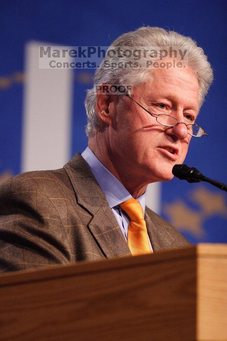 Former President Bill Clinton hands out commitment certificates to CGIU attendees for their exceptional pledges to the CGI cause during the opening plenary session of the CGIU meeting.  Day one of the 2nd Annual Clinton Global Initiative University (CGIU) meeting was held at The University of Texas at Austin, Friday, February 13, 2009.

Filename: SRM_20090213_16394784.jpg
Aperture: f/2.8
Shutter Speed: 1/250
Body: Canon EOS 20D
Lens: Canon EF 300mm f/2.8 L IS