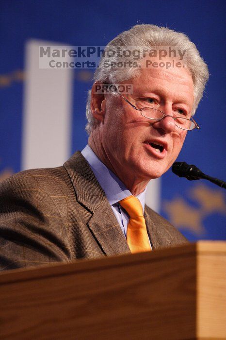 Former President Bill Clinton hands out commitment certificates to CGIU attendees for their exceptional pledges to the CGI cause during the opening plenary session of the CGIU meeting.  Day one of the 2nd Annual Clinton Global Initiative University (CGIU) meeting was held at The University of Texas at Austin, Friday, February 13, 2009.

Filename: SRM_20090213_16394786.jpg
Aperture: f/2.8
Shutter Speed: 1/250
Body: Canon EOS 20D
Lens: Canon EF 300mm f/2.8 L IS