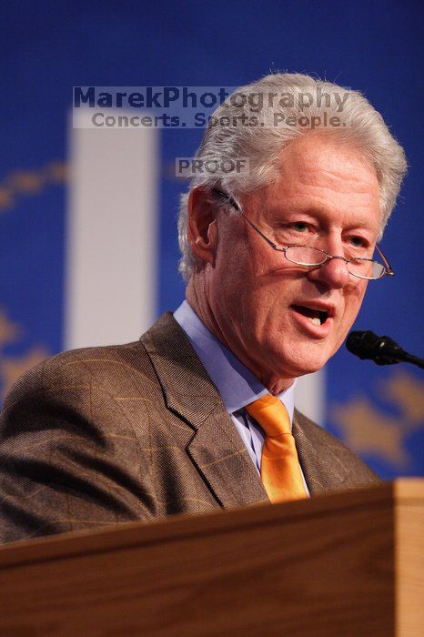 Former President Bill Clinton hands out commitment certificates to CGIU attendees for their exceptional pledges to the CGI cause during the opening plenary session of the CGIU meeting.  Day one of the 2nd Annual Clinton Global Initiative University (CGIU) meeting was held at The University of Texas at Austin, Friday, February 13, 2009.

Filename: SRM_20090213_16394987.jpg
Aperture: f/2.8
Shutter Speed: 1/250
Body: Canon EOS 20D
Lens: Canon EF 300mm f/2.8 L IS