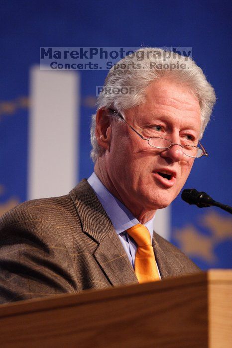 Former President Bill Clinton hands out commitment certificates to CGIU attendees for their exceptional pledges to the CGI cause during the opening plenary session of the CGIU meeting.  Day one of the 2nd Annual Clinton Global Initiative University (CGIU) meeting was held at The University of Texas at Austin, Friday, February 13, 2009.

Filename: SRM_20090213_16395290.jpg
Aperture: f/2.8
Shutter Speed: 1/250
Body: Canon EOS 20D
Lens: Canon EF 300mm f/2.8 L IS