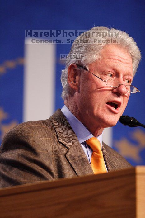 Former President Bill Clinton hands out commitment certificates to CGIU attendees for their exceptional pledges to the CGI cause during the opening plenary session of the CGIU meeting.  Day one of the 2nd Annual Clinton Global Initiative University (CGIU) meeting was held at The University of Texas at Austin, Friday, February 13, 2009.

Filename: SRM_20090213_16395791.jpg
Aperture: f/2.8
Shutter Speed: 1/250
Body: Canon EOS 20D
Lens: Canon EF 300mm f/2.8 L IS