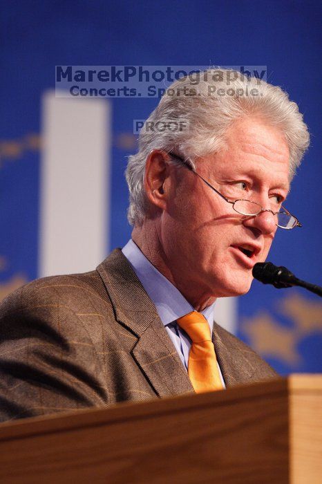 Former President Bill Clinton hands out commitment certificates to CGIU attendees for their exceptional pledges to the CGI cause during the opening plenary session of the CGIU meeting.  Day one of the 2nd Annual Clinton Global Initiative University (CGIU) meeting was held at The University of Texas at Austin, Friday, February 13, 2009.

Filename: SRM_20090213_16395792.jpg
Aperture: f/2.8
Shutter Speed: 1/250
Body: Canon EOS 20D
Lens: Canon EF 300mm f/2.8 L IS