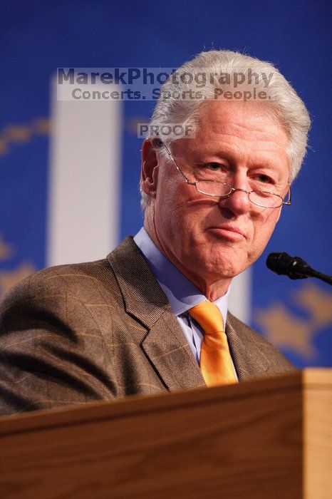 Former President Bill Clinton hands out commitment certificates to CGIU attendees for their exceptional pledges to the CGI cause during the opening plenary session of the CGIU meeting.  Day one of the 2nd Annual Clinton Global Initiative University (CGIU) meeting was held at The University of Texas at Austin, Friday, February 13, 2009.

Filename: SRM_20090213_16400293.jpg
Aperture: f/2.8
Shutter Speed: 1/250
Body: Canon EOS 20D
Lens: Canon EF 300mm f/2.8 L IS