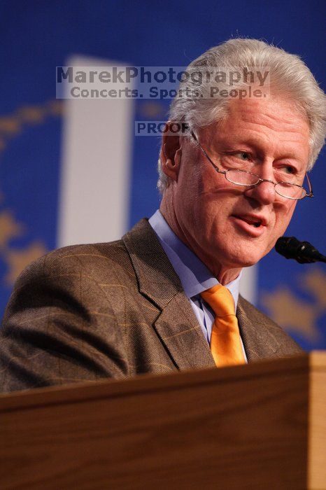 Former President Bill Clinton hands out commitment certificates to CGIU attendees for their exceptional pledges to the CGI cause during the opening plenary session of the CGIU meeting.  Day one of the 2nd Annual Clinton Global Initiative University (CGIU) meeting was held at The University of Texas at Austin, Friday, February 13, 2009.

Filename: SRM_20090213_16400696.jpg
Aperture: f/2.8
Shutter Speed: 1/320
Body: Canon EOS 20D
Lens: Canon EF 300mm f/2.8 L IS