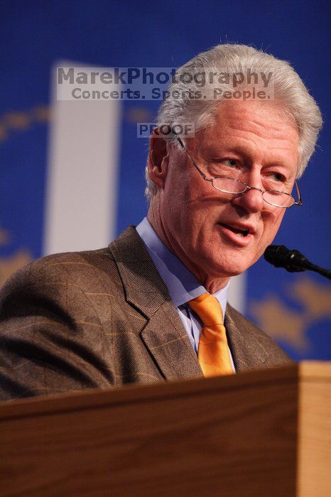 Former President Bill Clinton hands out commitment certificates to CGIU attendees for their exceptional pledges to the CGI cause during the opening plenary session of the CGIU meeting.  Day one of the 2nd Annual Clinton Global Initiative University (CGIU) meeting was held at The University of Texas at Austin, Friday, February 13, 2009.

Filename: SRM_20090213_16400697.jpg
Aperture: f/2.8
Shutter Speed: 1/320
Body: Canon EOS 20D
Lens: Canon EF 300mm f/2.8 L IS