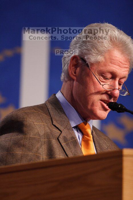 Former President Bill Clinton hands out commitment certificates to CGIU attendees for their exceptional pledges to the CGI cause during the opening plenary session of the CGIU meeting.  Day one of the 2nd Annual Clinton Global Initiative University (CGIU) meeting was held at The University of Texas at Austin, Friday, February 13, 2009.

Filename: SRM_20090213_16400798.jpg
Aperture: f/2.8
Shutter Speed: 1/320
Body: Canon EOS 20D
Lens: Canon EF 300mm f/2.8 L IS