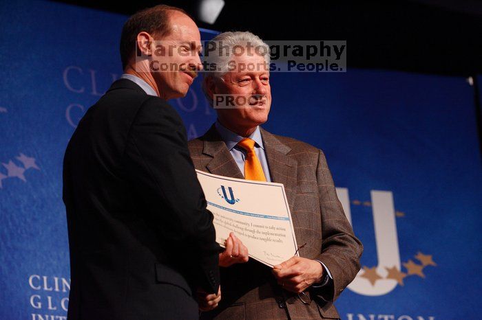 Former President Bill Clinton hands out commitment certificates to CGIU attendees for their exceptional pledges to the CGI cause during the opening plenary session of the CGIU meeting.  Day one of the 2nd Annual Clinton Global Initiative University (CGIU) meeting was held at The University of Texas at Austin, Friday, February 13, 2009.

Filename: SRM_20090213_16401948.jpg
Aperture: f/4.0
Shutter Speed: 1/200
Body: Canon EOS-1D Mark II
Lens: Canon EF 80-200mm f/2.8 L