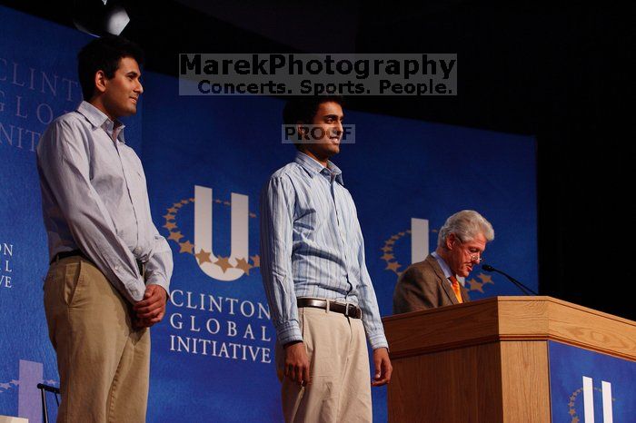 Former President Bill Clinton hands out commitment certificates to CGIU attendees for their exceptional pledges to the CGI cause during the opening plenary session of the CGIU meeting.  Day one of the 2nd Annual Clinton Global Initiative University (CGIU) meeting was held at The University of Texas at Austin, Friday, February 13, 2009.

Filename: SRM_20090213_16404850.jpg
Aperture: f/4.0
Shutter Speed: 1/200
Body: Canon EOS-1D Mark II
Lens: Canon EF 80-200mm f/2.8 L