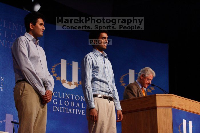 Former President Bill Clinton hands out commitment certificates to CGIU attendees for their exceptional pledges to the CGI cause during the opening plenary session of the CGIU meeting.  Day one of the 2nd Annual Clinton Global Initiative University (CGIU) meeting was held at The University of Texas at Austin, Friday, February 13, 2009.

Filename: SRM_20090213_16404951.jpg
Aperture: f/4.0
Shutter Speed: 1/200
Body: Canon EOS-1D Mark II
Lens: Canon EF 80-200mm f/2.8 L