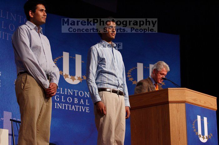 Former President Bill Clinton hands out commitment certificates to CGIU attendees for their exceptional pledges to the CGI cause during the opening plenary session of the CGIU meeting.  Day one of the 2nd Annual Clinton Global Initiative University (CGIU) meeting was held at The University of Texas at Austin, Friday, February 13, 2009.

Filename: SRM_20090213_16410552.jpg
Aperture: f/4.0
Shutter Speed: 1/200
Body: Canon EOS-1D Mark II
Lens: Canon EF 80-200mm f/2.8 L