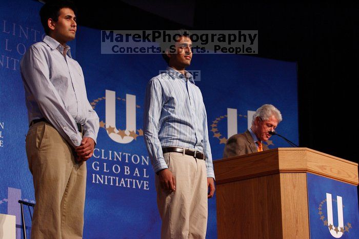 Former President Bill Clinton hands out commitment certificates to CGIU attendees for their exceptional pledges to the CGI cause during the opening plenary session of the CGIU meeting.  Day one of the 2nd Annual Clinton Global Initiative University (CGIU) meeting was held at The University of Texas at Austin, Friday, February 13, 2009.

Filename: SRM_20090213_16411054.jpg
Aperture: f/4.0
Shutter Speed: 1/200
Body: Canon EOS-1D Mark II
Lens: Canon EF 80-200mm f/2.8 L