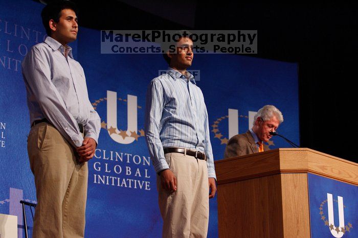 Former President Bill Clinton hands out commitment certificates to CGIU attendees for their exceptional pledges to the CGI cause during the opening plenary session of the CGIU meeting.  Day one of the 2nd Annual Clinton Global Initiative University (CGIU) meeting was held at The University of Texas at Austin, Friday, February 13, 2009.

Filename: SRM_20090213_16411055.jpg
Aperture: f/4.0
Shutter Speed: 1/200
Body: Canon EOS-1D Mark II
Lens: Canon EF 80-200mm f/2.8 L