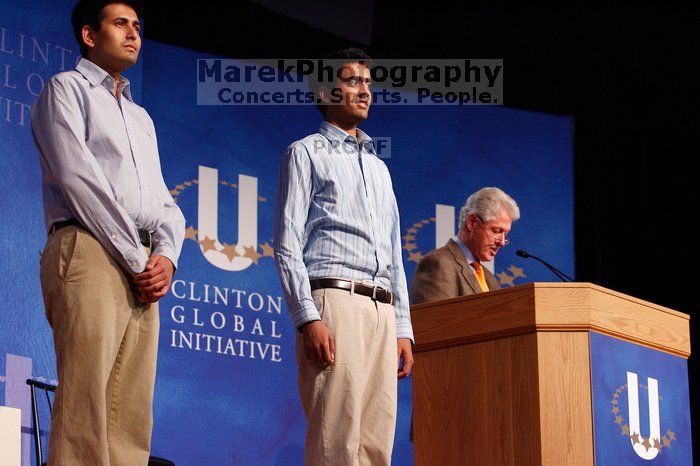 Former President Bill Clinton hands out commitment certificates to CGIU attendees for their exceptional pledges to the CGI cause during the opening plenary session of the CGIU meeting.  Day one of the 2nd Annual Clinton Global Initiative University (CGIU) meeting was held at The University of Texas at Austin, Friday, February 13, 2009.

Filename: SRM_20090213_16411657.jpg
Aperture: f/4.0
Shutter Speed: 1/125
Body: Canon EOS-1D Mark II
Lens: Canon EF 80-200mm f/2.8 L