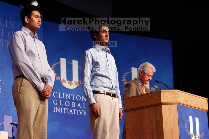 Former President Bill Clinton hands out commitment certificates to CGIU attendees for their exceptional pledges to the CGI cause during the opening plenary session of the CGIU meeting.  Day one of the 2nd Annual Clinton Global Initiative University (CGIU) meeting was held at The University of Texas at Austin, Friday, February 13, 2009.

Filename: SRM_20090213_16412358.jpg
Aperture: f/4.0
Shutter Speed: 1/125
Body: Canon EOS-1D Mark II
Lens: Canon EF 80-200mm f/2.8 L