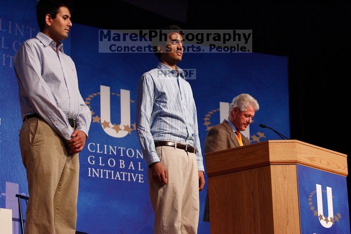 Former President Bill Clinton hands out commitment certificates to CGIU attendees for their exceptional pledges to the CGI cause during the opening plenary session of the CGIU meeting.  Day one of the 2nd Annual Clinton Global Initiative University (CGIU) meeting was held at The University of Texas at Austin, Friday, February 13, 2009.

Filename: SRM_20090213_16412760.jpg
Aperture: f/4.0
Shutter Speed: 1/160
Body: Canon EOS-1D Mark II
Lens: Canon EF 80-200mm f/2.8 L