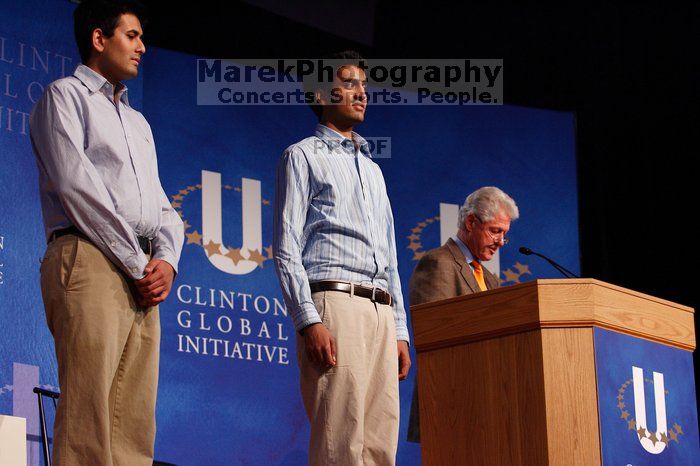 Former President Bill Clinton hands out commitment certificates to CGIU attendees for their exceptional pledges to the CGI cause during the opening plenary session of the CGIU meeting.  Day one of the 2nd Annual Clinton Global Initiative University (CGIU) meeting was held at The University of Texas at Austin, Friday, February 13, 2009.

Filename: SRM_20090213_16412761.jpg
Aperture: f/4.0
Shutter Speed: 1/160
Body: Canon EOS-1D Mark II
Lens: Canon EF 80-200mm f/2.8 L