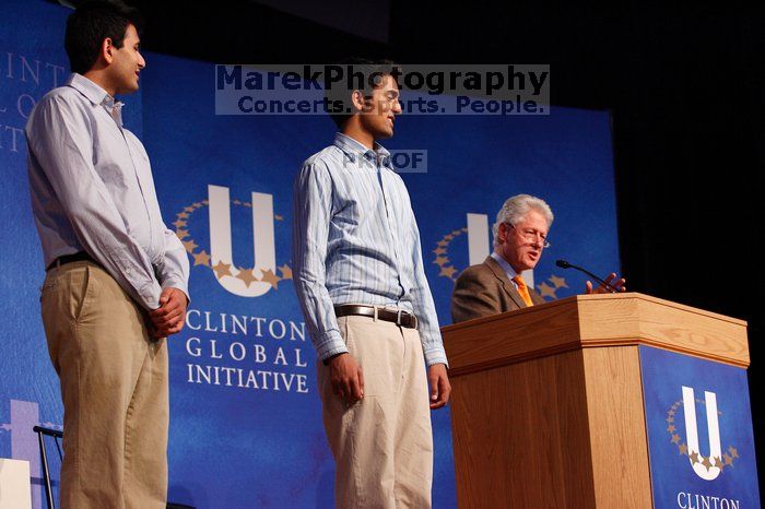 Former President Bill Clinton hands out commitment certificates to CGIU attendees for their exceptional pledges to the CGI cause during the opening plenary session of the CGIU meeting.  Day one of the 2nd Annual Clinton Global Initiative University (CGIU) meeting was held at The University of Texas at Austin, Friday, February 13, 2009.

Filename: SRM_20090213_16420362.jpg
Aperture: f/4.0
Shutter Speed: 1/160
Body: Canon EOS-1D Mark II
Lens: Canon EF 80-200mm f/2.8 L