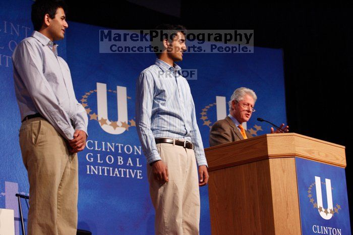 Former President Bill Clinton hands out commitment certificates to CGIU attendees for their exceptional pledges to the CGI cause during the opening plenary session of the CGIU meeting.  Day one of the 2nd Annual Clinton Global Initiative University (CGIU) meeting was held at The University of Texas at Austin, Friday, February 13, 2009.

Filename: SRM_20090213_16420463.jpg
Aperture: f/4.0
Shutter Speed: 1/160
Body: Canon EOS-1D Mark II
Lens: Canon EF 80-200mm f/2.8 L