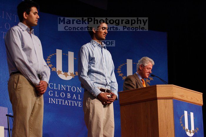 Former President Bill Clinton hands out commitment certificates to CGIU attendees for their exceptional pledges to the CGI cause during the opening plenary session of the CGIU meeting.  Day one of the 2nd Annual Clinton Global Initiative University (CGIU) meeting was held at The University of Texas at Austin, Friday, February 13, 2009.

Filename: SRM_20090213_16423069.jpg
Aperture: f/4.0
Shutter Speed: 1/200
Body: Canon EOS-1D Mark II
Lens: Canon EF 80-200mm f/2.8 L