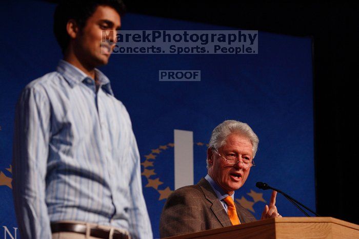 Former President Bill Clinton hands out commitment certificates to CGIU attendees for their exceptional pledges to the CGI cause during the opening plenary session of the CGIU meeting.  Day one of the 2nd Annual Clinton Global Initiative University (CGIU) meeting was held at The University of Texas at Austin, Friday, February 13, 2009.

Filename: SRM_20090213_16423670.jpg
Aperture: f/4.0
Shutter Speed: 1/200
Body: Canon EOS-1D Mark II
Lens: Canon EF 80-200mm f/2.8 L