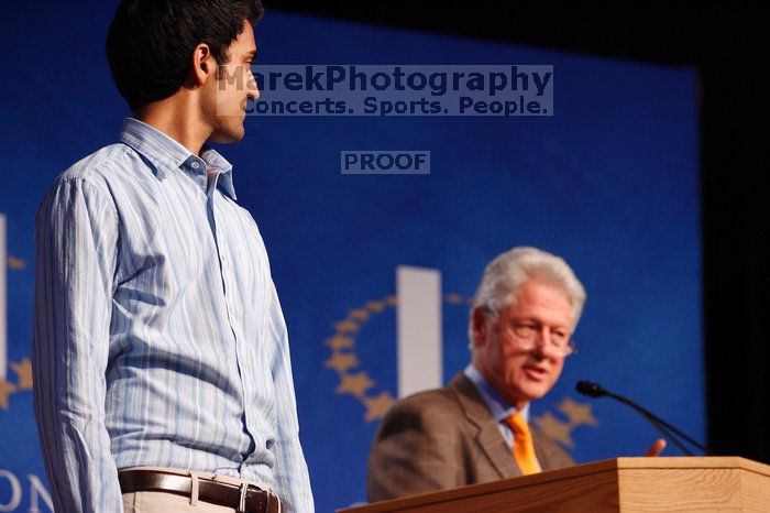 Former President Bill Clinton hands out commitment certificates to CGIU attendees for their exceptional pledges to the CGI cause during the opening plenary session of the CGIU meeting.  Day one of the 2nd Annual Clinton Global Initiative University (CGIU) meeting was held at The University of Texas at Austin, Friday, February 13, 2009.

Filename: SRM_20090213_16423973.jpg
Aperture: f/4.0
Shutter Speed: 1/125
Body: Canon EOS-1D Mark II
Lens: Canon EF 80-200mm f/2.8 L