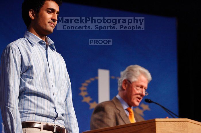 Former President Bill Clinton hands out commitment certificates to CGIU attendees for their exceptional pledges to the CGI cause during the opening plenary session of the CGIU meeting.  Day one of the 2nd Annual Clinton Global Initiative University (CGIU) meeting was held at The University of Texas at Austin, Friday, February 13, 2009.

Filename: SRM_20090213_16424174.jpg
Aperture: f/4.0
Shutter Speed: 1/125
Body: Canon EOS-1D Mark II
Lens: Canon EF 80-200mm f/2.8 L