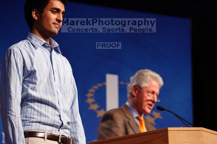 Former President Bill Clinton hands out commitment certificates to CGIU attendees for their exceptional pledges to the CGI cause during the opening plenary session of the CGIU meeting.  Day one of the 2nd Annual Clinton Global Initiative University (CGIU) meeting was held at The University of Texas at Austin, Friday, February 13, 2009.

Filename: SRM_20090213_16424175.jpg
Aperture: f/4.0
Shutter Speed: 1/125
Body: Canon EOS-1D Mark II
Lens: Canon EF 80-200mm f/2.8 L