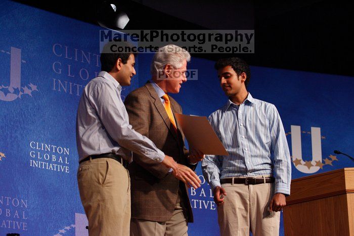 Former President Bill Clinton hands out commitment certificates to CGIU attendees for their exceptional pledges to the CGI cause during the opening plenary session of the CGIU meeting.  Day one of the 2nd Annual Clinton Global Initiative University (CGIU) meeting was held at The University of Texas at Austin, Friday, February 13, 2009.

Filename: SRM_20090213_16425179.jpg
Aperture: f/4.0
Shutter Speed: 1/160
Body: Canon EOS-1D Mark II
Lens: Canon EF 80-200mm f/2.8 L