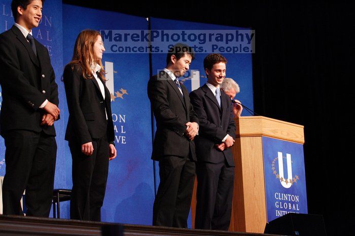 Former President Bill Clinton hands out commitment certificates to CGIU attendees for their exceptional pledges to the CGI cause during the opening plenary session of the CGIU meeting.  Day one of the 2nd Annual Clinton Global Initiative University (CGIU) meeting was held at The University of Texas at Austin, Friday, February 13, 2009.

Filename: SRM_20090213_16434499.jpg
Aperture: f/4.0
Shutter Speed: 1/100
Body: Canon EOS-1D Mark II
Lens: Canon EF 80-200mm f/2.8 L