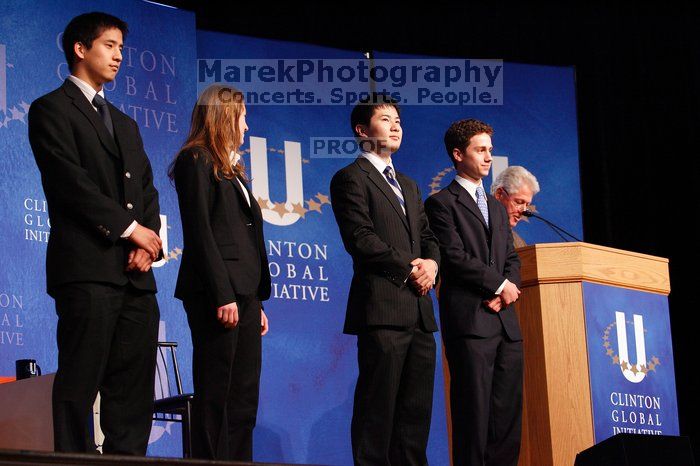 Former President Bill Clinton hands out commitment certificates to CGIU attendees for their exceptional pledges to the CGI cause during the opening plenary session of the CGIU meeting.  Day one of the 2nd Annual Clinton Global Initiative University (CGIU) meeting was held at The University of Texas at Austin, Friday, February 13, 2009.

Filename: SRM_20090213_16435000.jpg
Aperture: f/4.0
Shutter Speed: 1/100
Body: Canon EOS-1D Mark II
Lens: Canon EF 80-200mm f/2.8 L