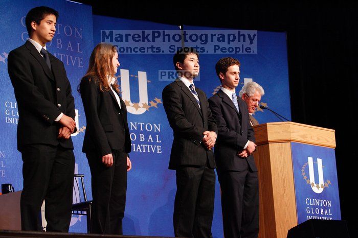 Former President Bill Clinton hands out commitment certificates to CGIU attendees for their exceptional pledges to the CGI cause during the opening plenary session of the CGIU meeting.  Day one of the 2nd Annual Clinton Global Initiative University (CGIU) meeting was held at The University of Texas at Austin, Friday, February 13, 2009.

Filename: SRM_20090213_16435203.jpg
Aperture: f/4.0
Shutter Speed: 1/100
Body: Canon EOS-1D Mark II
Lens: Canon EF 80-200mm f/2.8 L