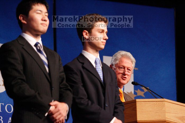 Former President Bill Clinton hands out commitment certificates to CGIU attendees for their exceptional pledges to the CGI cause during the opening plenary session of the CGIU meeting.  Day one of the 2nd Annual Clinton Global Initiative University (CGIU) meeting was held at The University of Texas at Austin, Friday, February 13, 2009.

Filename: SRM_20090213_16452209.jpg
Aperture: f/4.0
Shutter Speed: 1/125
Body: Canon EOS-1D Mark II
Lens: Canon EF 80-200mm f/2.8 L