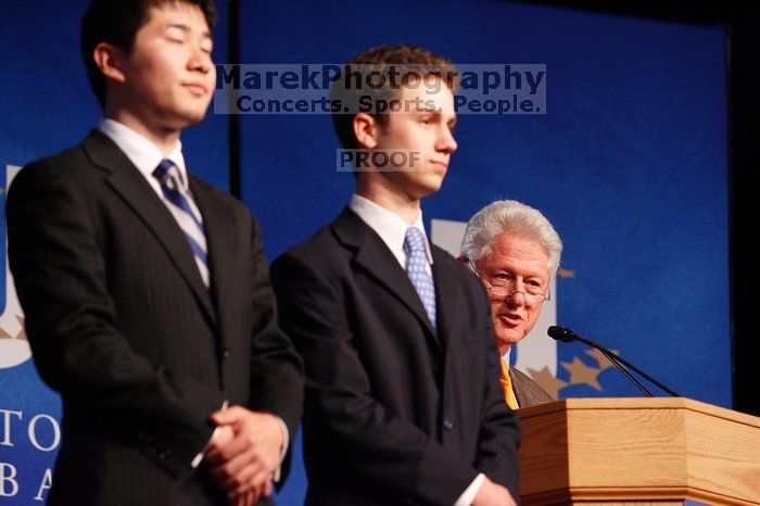 Former President Bill Clinton hands out commitment certificates to CGIU attendees for their exceptional pledges to the CGI cause during the opening plenary session of the CGIU meeting.  Day one of the 2nd Annual Clinton Global Initiative University (CGIU) meeting was held at The University of Texas at Austin, Friday, February 13, 2009.

Filename: SRM_20090213_16452310.jpg
Aperture: f/4.0
Shutter Speed: 1/125
Body: Canon EOS-1D Mark II
Lens: Canon EF 80-200mm f/2.8 L