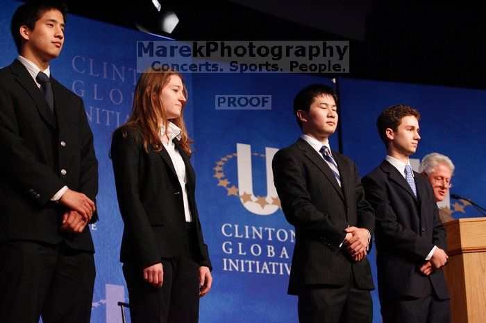 Former President Bill Clinton hands out commitment certificates to CGIU attendees for their exceptional pledges to the CGI cause during the opening plenary session of the CGIU meeting.  Day one of the 2nd Annual Clinton Global Initiative University (CGIU) meeting was held at The University of Texas at Austin, Friday, February 13, 2009.

Filename: SRM_20090213_16453614.jpg
Aperture: f/4.0
Shutter Speed: 1/125
Body: Canon EOS-1D Mark II
Lens: Canon EF 80-200mm f/2.8 L