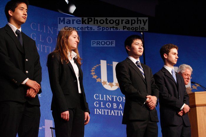 Former President Bill Clinton hands out commitment certificates to CGIU attendees for their exceptional pledges to the CGI cause during the opening plenary session of the CGIU meeting.  Day one of the 2nd Annual Clinton Global Initiative University (CGIU) meeting was held at The University of Texas at Austin, Friday, February 13, 2009.

Filename: SRM_20090213_16453615.jpg
Aperture: f/4.0
Shutter Speed: 1/125
Body: Canon EOS-1D Mark II
Lens: Canon EF 80-200mm f/2.8 L