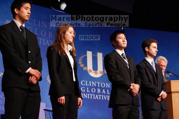 Former President Bill Clinton hands out commitment certificates to CGIU attendees for their exceptional pledges to the CGI cause during the opening plenary session of the CGIU meeting.  Day one of the 2nd Annual Clinton Global Initiative University (CGIU) meeting was held at The University of Texas at Austin, Friday, February 13, 2009.

Filename: SRM_20090213_16454416.jpg
Aperture: f/4.0
Shutter Speed: 1/125
Body: Canon EOS-1D Mark II
Lens: Canon EF 80-200mm f/2.8 L