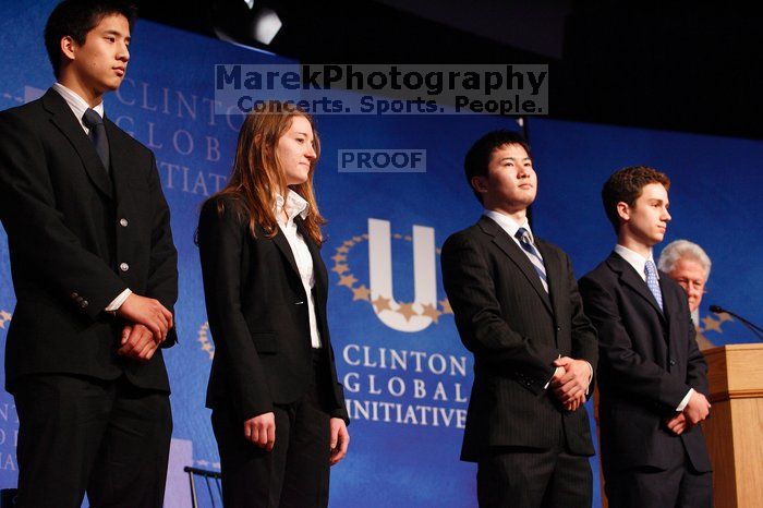 Former President Bill Clinton hands out commitment certificates to CGIU attendees for their exceptional pledges to the CGI cause during the opening plenary session of the CGIU meeting.  Day one of the 2nd Annual Clinton Global Initiative University (CGIU) meeting was held at The University of Texas at Austin, Friday, February 13, 2009.

Filename: SRM_20090213_16454417.jpg
Aperture: f/4.0
Shutter Speed: 1/125
Body: Canon EOS-1D Mark II
Lens: Canon EF 80-200mm f/2.8 L