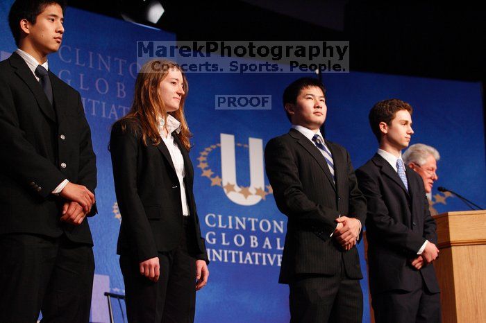 Former President Bill Clinton hands out commitment certificates to CGIU attendees for their exceptional pledges to the CGI cause during the opening plenary session of the CGIU meeting.  Day one of the 2nd Annual Clinton Global Initiative University (CGIU) meeting was held at The University of Texas at Austin, Friday, February 13, 2009.

Filename: SRM_20090213_16454718.jpg
Aperture: f/4.0
Shutter Speed: 1/125
Body: Canon EOS-1D Mark II
Lens: Canon EF 80-200mm f/2.8 L