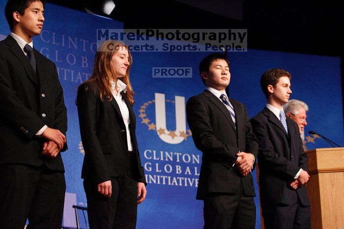 Former President Bill Clinton hands out commitment certificates to CGIU attendees for their exceptional pledges to the CGI cause during the opening plenary session of the CGIU meeting.  Day one of the 2nd Annual Clinton Global Initiative University (CGIU) meeting was held at The University of Texas at Austin, Friday, February 13, 2009.

Filename: SRM_20090213_16454719.jpg
Aperture: f/4.0
Shutter Speed: 1/125
Body: Canon EOS-1D Mark II
Lens: Canon EF 80-200mm f/2.8 L