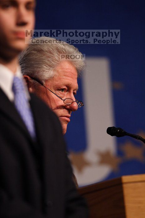 Former President Bill Clinton hands out commitment certificates to CGIU attendees for their exceptional pledges to the CGI cause during the opening plenary session of the CGIU meeting.  Day one of the 2nd Annual Clinton Global Initiative University (CGIU) meeting was held at The University of Texas at Austin, Friday, February 13, 2009.

Filename: SRM_20090213_16461712.jpg
Aperture: f/2.8
Shutter Speed: 1/400
Body: Canon EOS 20D
Lens: Canon EF 300mm f/2.8 L IS