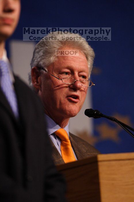 Former President Bill Clinton hands out commitment certificates to CGIU attendees for their exceptional pledges to the CGI cause during the opening plenary session of the CGIU meeting.  Day one of the 2nd Annual Clinton Global Initiative University (CGIU) meeting was held at The University of Texas at Austin, Friday, February 13, 2009.

Filename: SRM_20090213_16462515.jpg
Aperture: f/2.8
Shutter Speed: 1/400
Body: Canon EOS 20D
Lens: Canon EF 300mm f/2.8 L IS