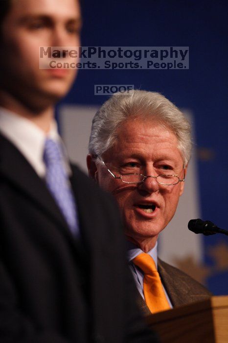 Former President Bill Clinton hands out commitment certificates to CGIU attendees for their exceptional pledges to the CGI cause during the opening plenary session of the CGIU meeting.  Day one of the 2nd Annual Clinton Global Initiative University (CGIU) meeting was held at The University of Texas at Austin, Friday, February 13, 2009.

Filename: SRM_20090213_16462616.jpg
Aperture: f/2.8
Shutter Speed: 1/400
Body: Canon EOS 20D
Lens: Canon EF 300mm f/2.8 L IS