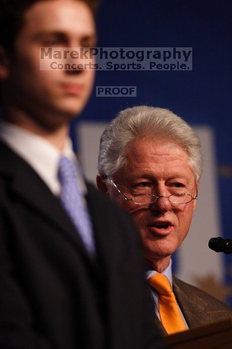 Former President Bill Clinton hands out commitment certificates to CGIU attendees for their exceptional pledges to the CGI cause during the opening plenary session of the CGIU meeting.  Day one of the 2nd Annual Clinton Global Initiative University (CGIU) meeting was held at The University of Texas at Austin, Friday, February 13, 2009.

Filename: SRM_20090213_16462817.jpg
Aperture: f/2.8
Shutter Speed: 1/400
Body: Canon EOS 20D
Lens: Canon EF 300mm f/2.8 L IS