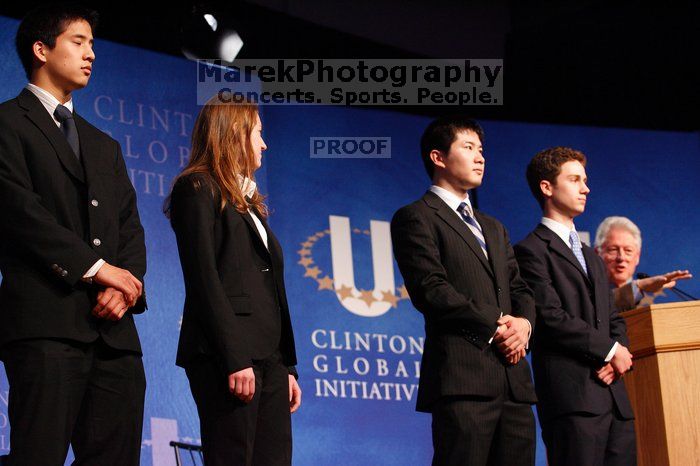 Former President Bill Clinton hands out commitment certificates to CGIU attendees for their exceptional pledges to the CGI cause during the opening plenary session of the CGIU meeting.  Day one of the 2nd Annual Clinton Global Initiative University (CGIU) meeting was held at The University of Texas at Austin, Friday, February 13, 2009.

Filename: SRM_20090213_16470821.jpg
Aperture: f/4.0
Shutter Speed: 1/100
Body: Canon EOS-1D Mark II
Lens: Canon EF 80-200mm f/2.8 L