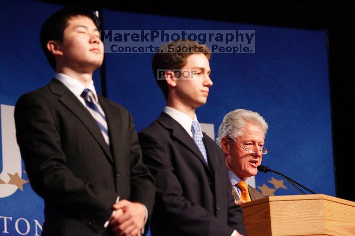 Former President Bill Clinton hands out commitment certificates to CGIU attendees for their exceptional pledges to the CGI cause during the opening plenary session of the CGIU meeting.  Day one of the 2nd Annual Clinton Global Initiative University (CGIU) meeting was held at The University of Texas at Austin, Friday, February 13, 2009.

Filename: SRM_20090213_16471425.jpg
Aperture: f/4.0
Shutter Speed: 1/100
Body: Canon EOS-1D Mark II
Lens: Canon EF 80-200mm f/2.8 L