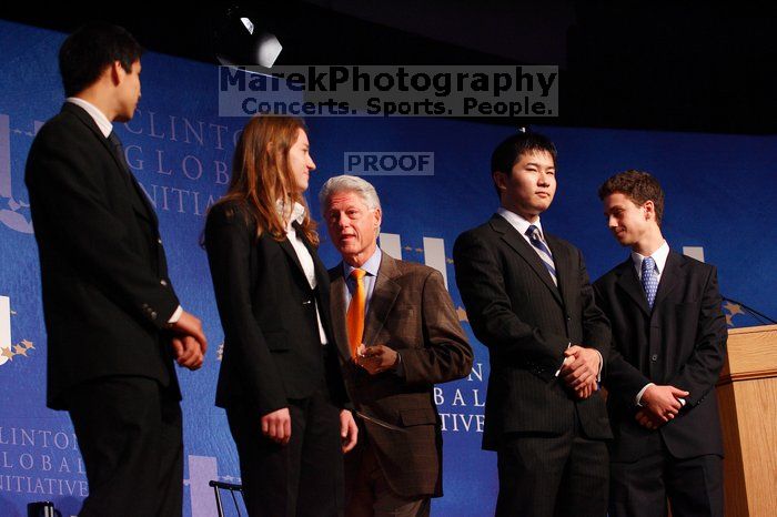 Former President Bill Clinton hands out commitment certificates to CGIU attendees for their exceptional pledges to the CGI cause during the opening plenary session of the CGIU meeting.  Day one of the 2nd Annual Clinton Global Initiative University (CGIU) meeting was held at The University of Texas at Austin, Friday, February 13, 2009.

Filename: SRM_20090213_16472527.jpg
Aperture: f/4.0
Shutter Speed: 1/125
Body: Canon EOS-1D Mark II
Lens: Canon EF 80-200mm f/2.8 L