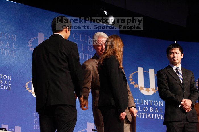 Former President Bill Clinton hands out commitment certificates to CGIU attendees for their exceptional pledges to the CGI cause during the opening plenary session of the CGIU meeting.  Day one of the 2nd Annual Clinton Global Initiative University (CGIU) meeting was held at The University of Texas at Austin, Friday, February 13, 2009.

Filename: SRM_20090213_16472729.jpg
Aperture: f/4.0
Shutter Speed: 1/100
Body: Canon EOS-1D Mark II
Lens: Canon EF 80-200mm f/2.8 L