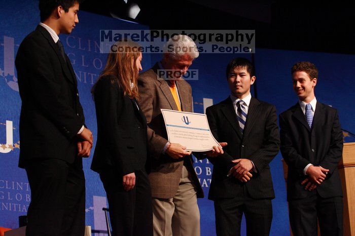 Former President Bill Clinton hands out commitment certificates to CGIU attendees for their exceptional pledges to the CGI cause during the opening plenary session of the CGIU meeting.  Day one of the 2nd Annual Clinton Global Initiative University (CGIU) meeting was held at The University of Texas at Austin, Friday, February 13, 2009.

Filename: SRM_20090213_16473337.jpg
Aperture: f/4.0
Shutter Speed: 1/160
Body: Canon EOS-1D Mark II
Lens: Canon EF 80-200mm f/2.8 L